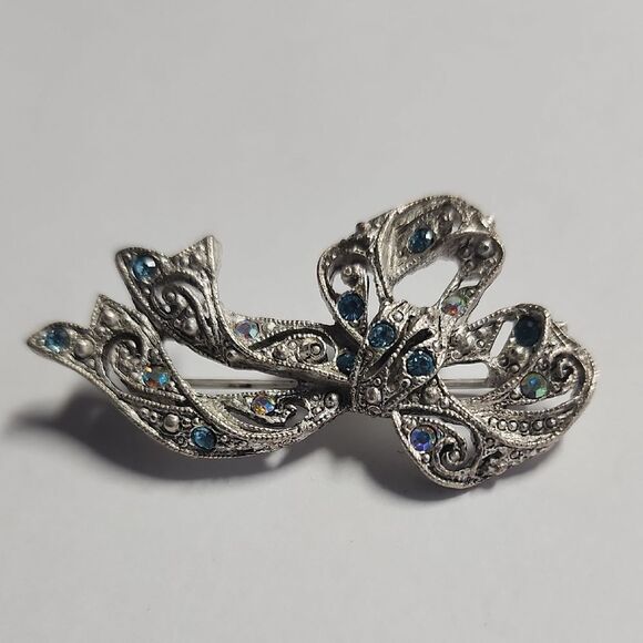 Elegant Silver Bow Brooch with Blue Accents - Picture 1 of 6